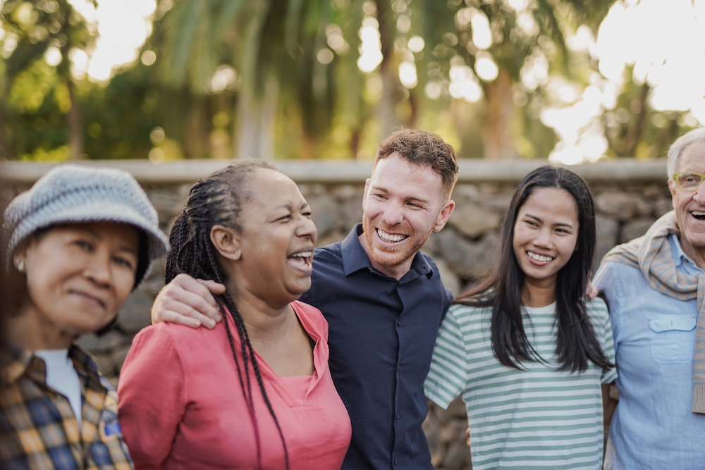 A group of people laugh together.