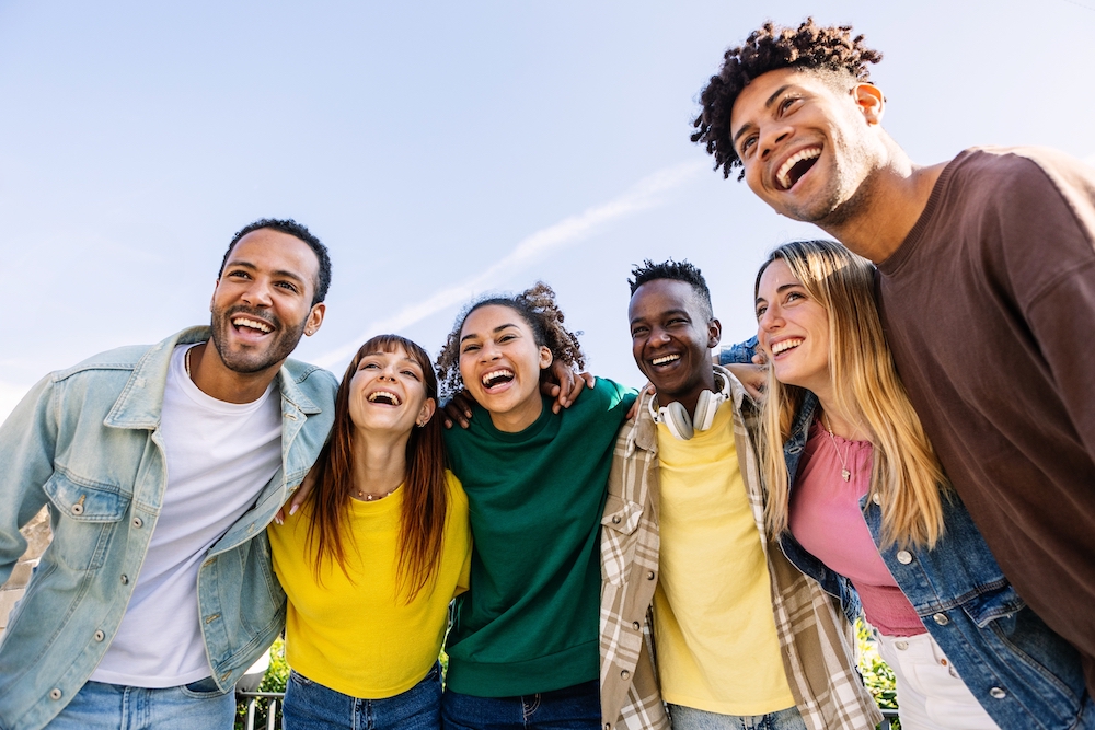 A group of people laugh together.