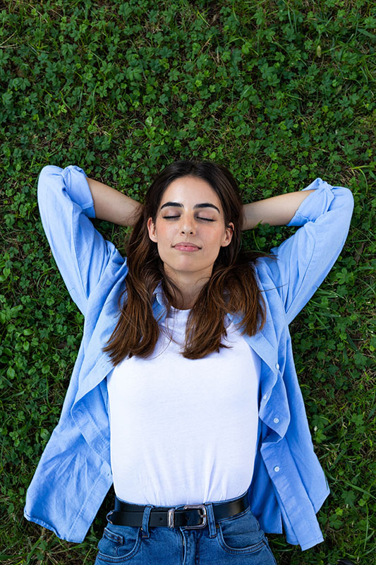 A woman relaxes after completing a drug rehab program.