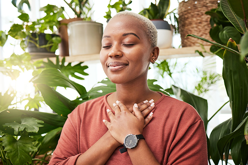 A woman practices mindfulness, one of the holistic techniques used at our drug rehab center.